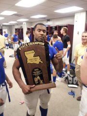 LaJaylin Smith holding the State Championship Trophy
