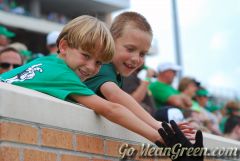 Young UNT fans high five