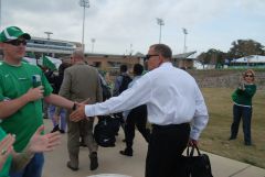 UNT Coach Dan McCarney shaking hands with fans